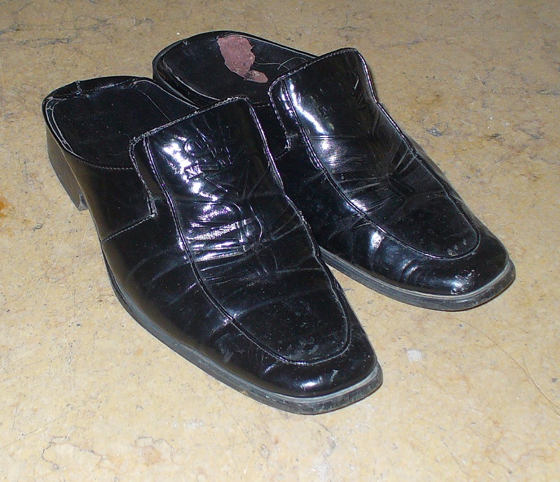 Backless dress shoes - the ultimate fashion statement at a wedding photo shoot.