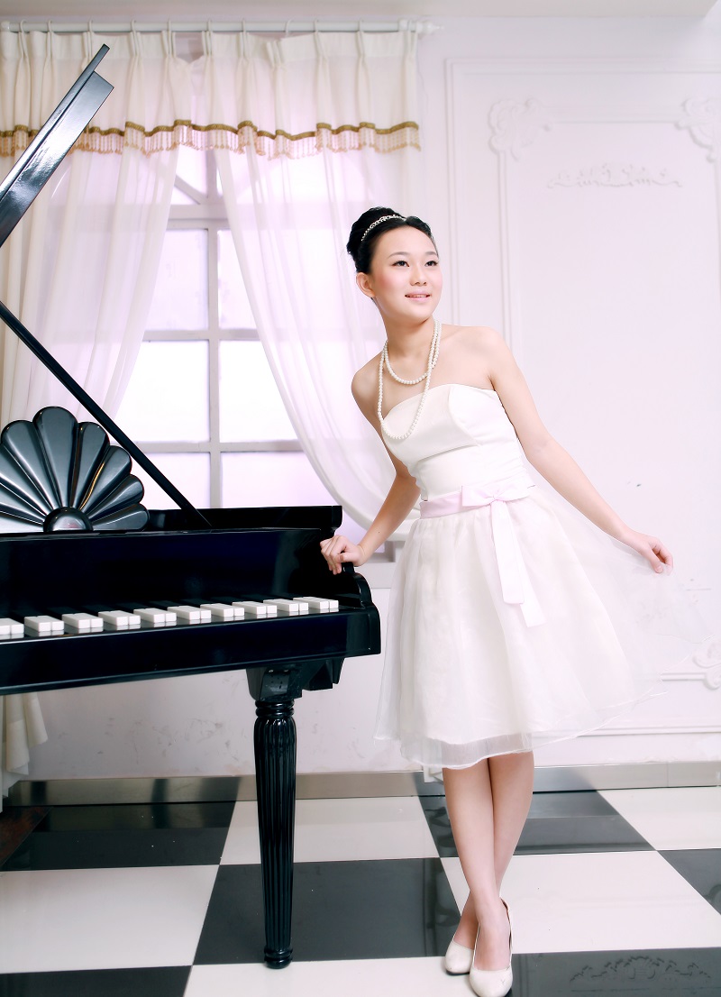 I love my daughter even if she's standing next to a fake piano.