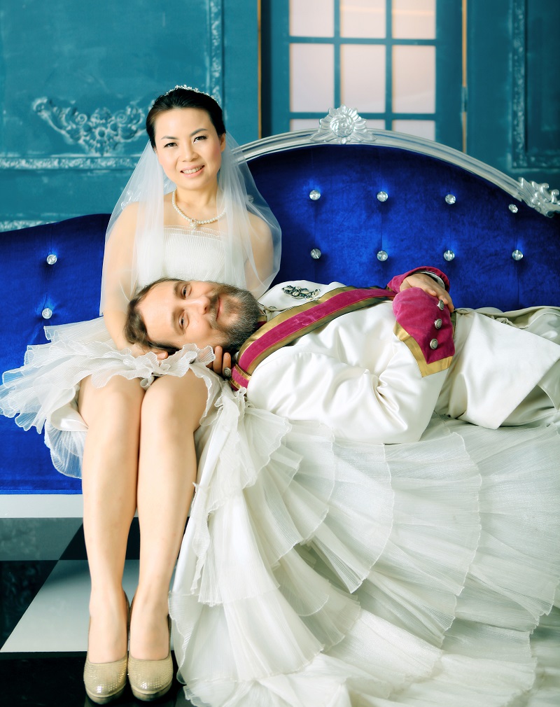 Relaxing on the long blue sofa - Scene 5 of My Big Guangdong Wedding photo shoot.