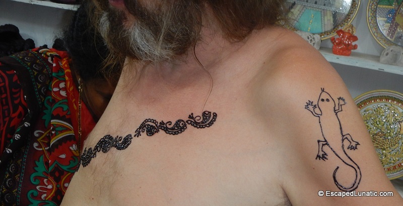 I think the lizard needs to lose some weight :-) Something's not right with that lizard tattoo