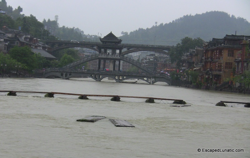 FengHuang. Floods cause problems with some low bridges.
