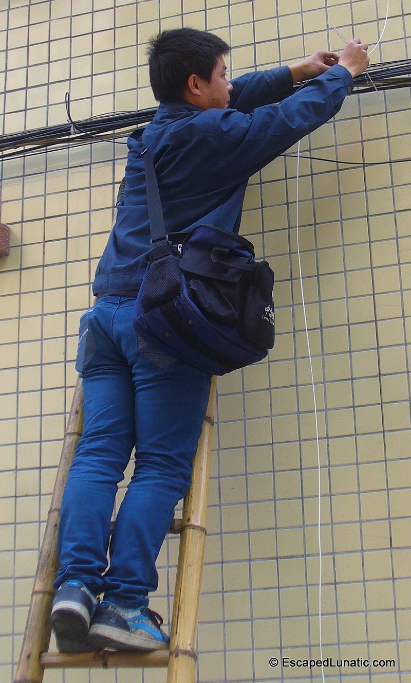 Two things needed for fiber optic cable installation - High Tech Cable and Bamboo Ladder
