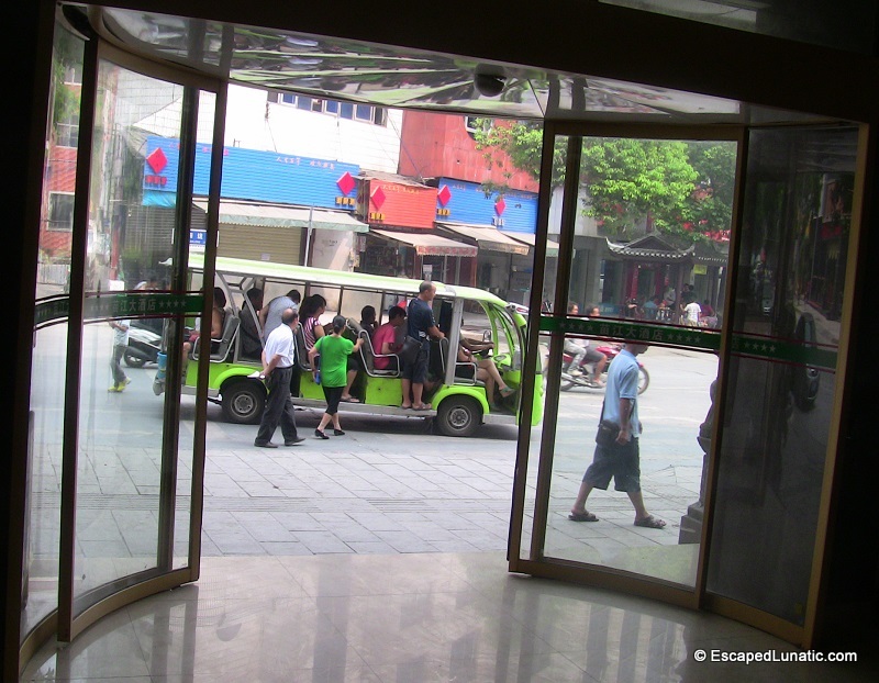 Golf Cart vs. Bus. What's the difference? In Feng Huang, there isn't one.