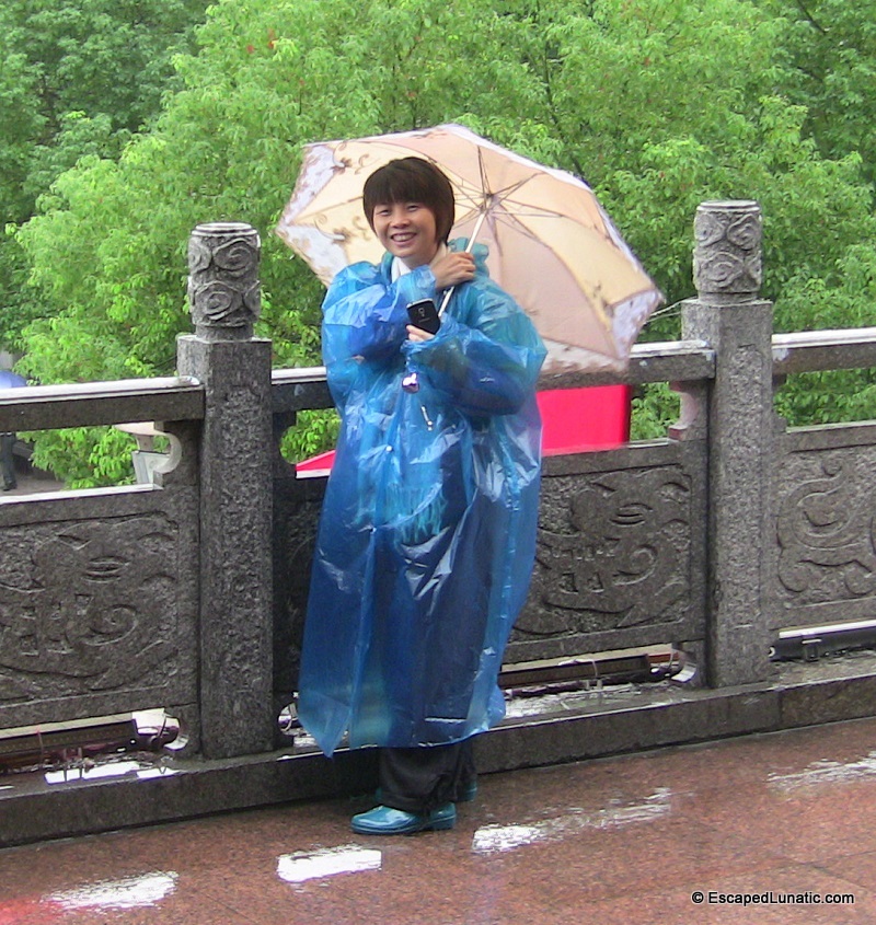 Sexy rubber boots and a body condom - just what's needed for honeymoon weather.