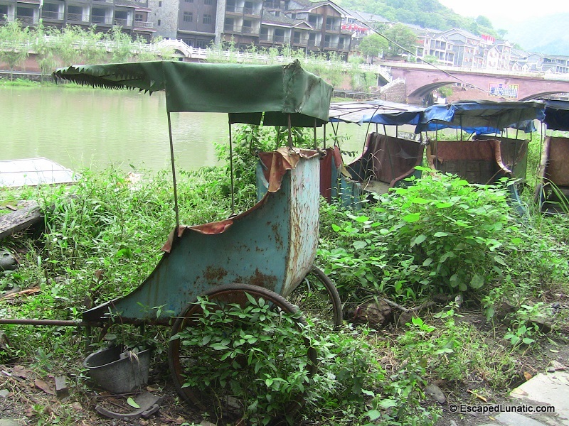 Graveyard of the rickshaws - These were the only rickshaws we saw in Feng Huang