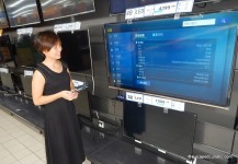 My lovely wife browsing some of the TVs available.